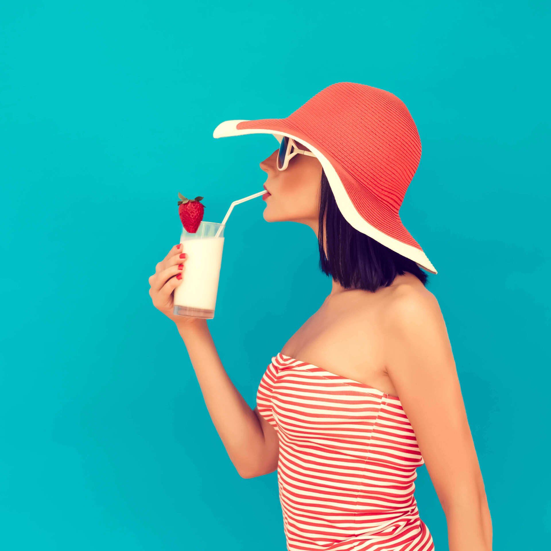 Woman sipping a drink