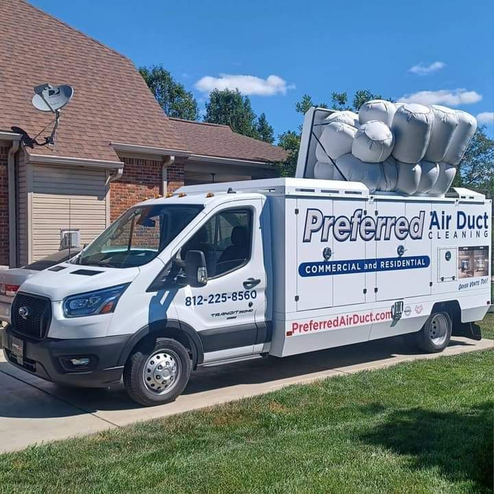A preferred air duct truck is parked in front of a house.