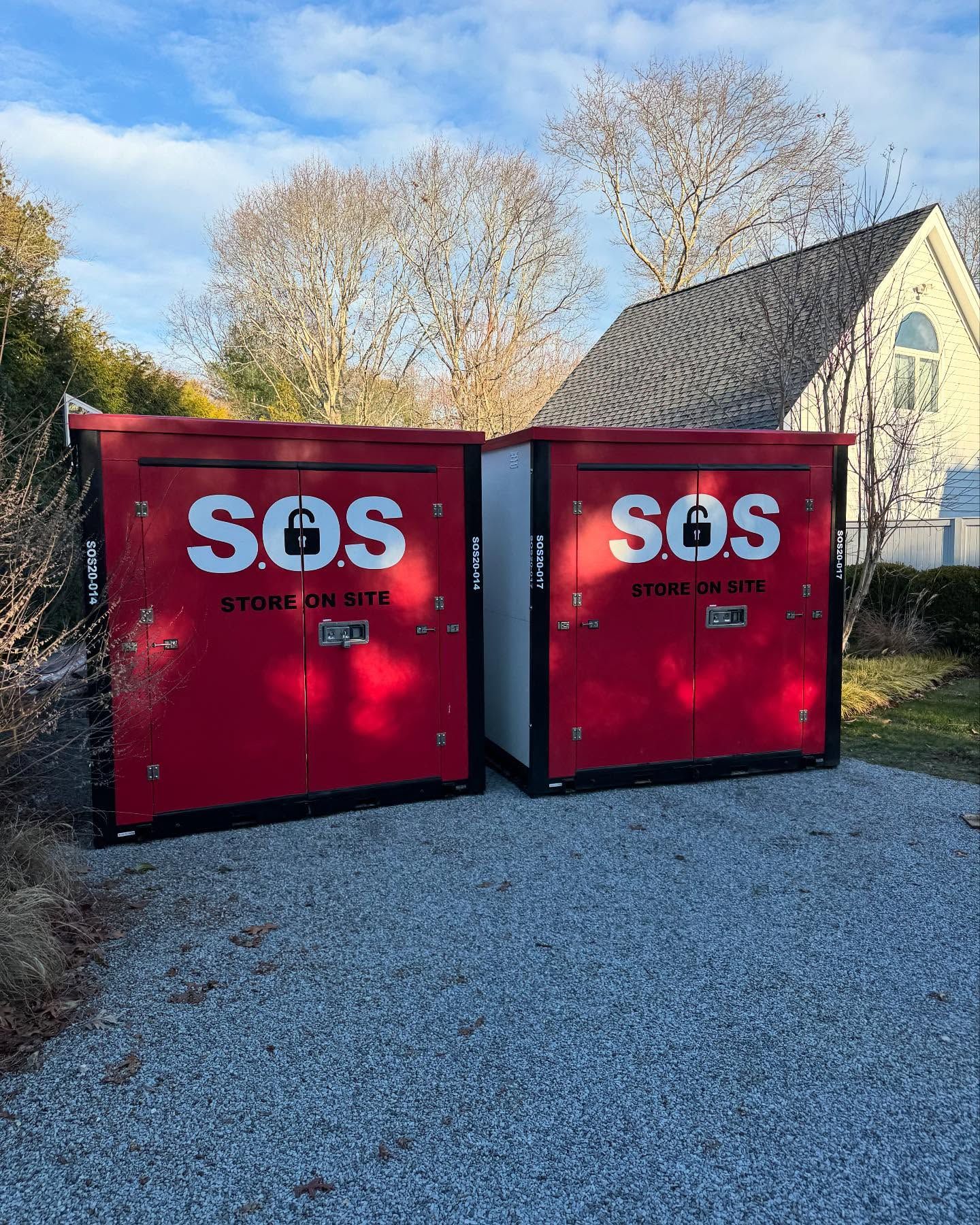 Two red storage containers labeled 