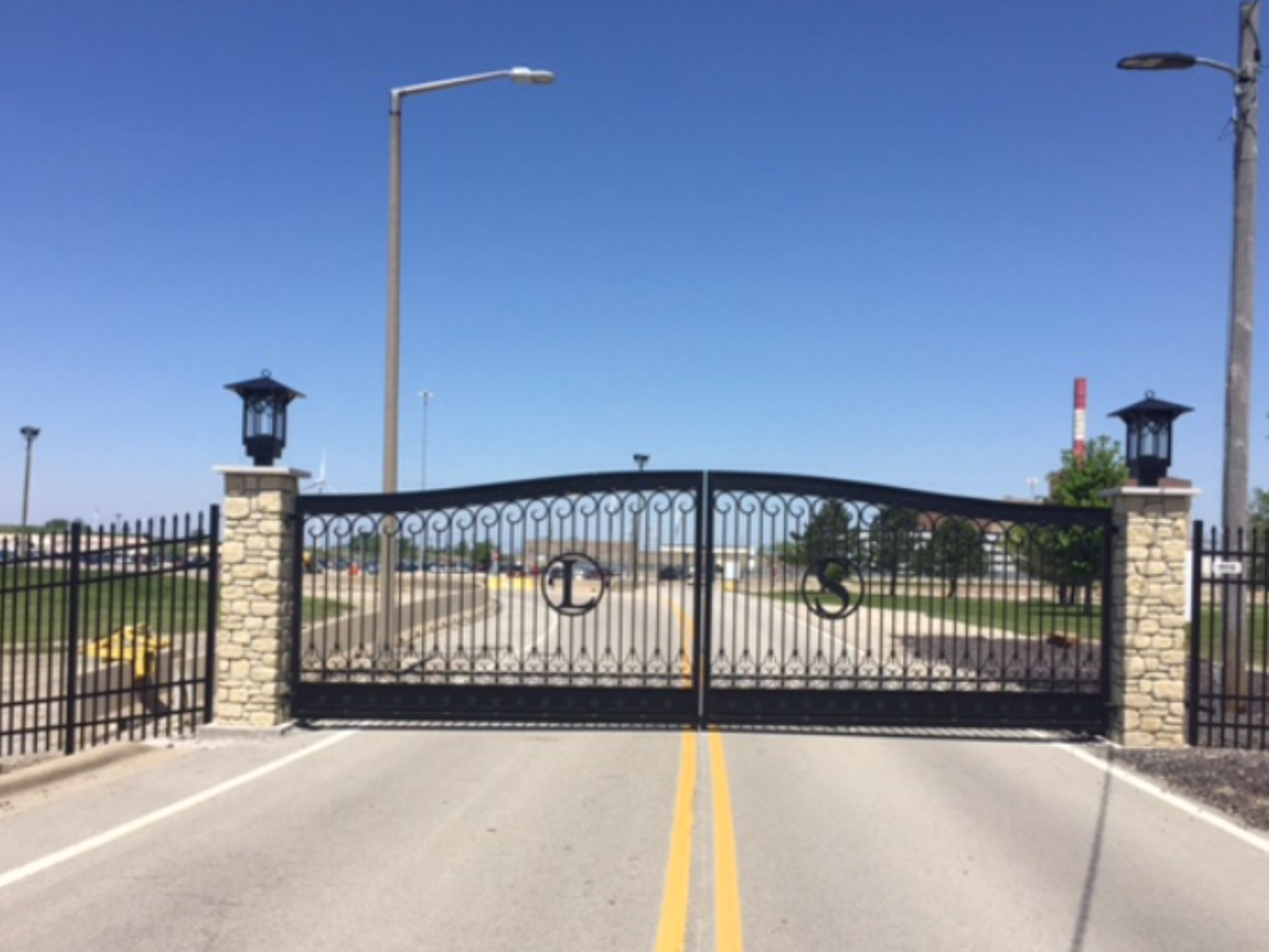 A wrought iron gate with an anchor on it
