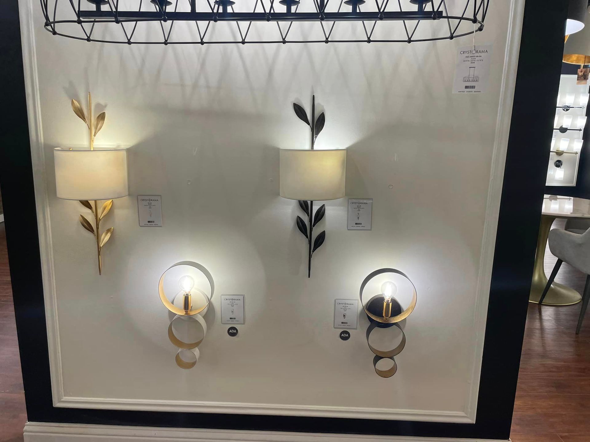 A wall with three different types of wall lights on it.