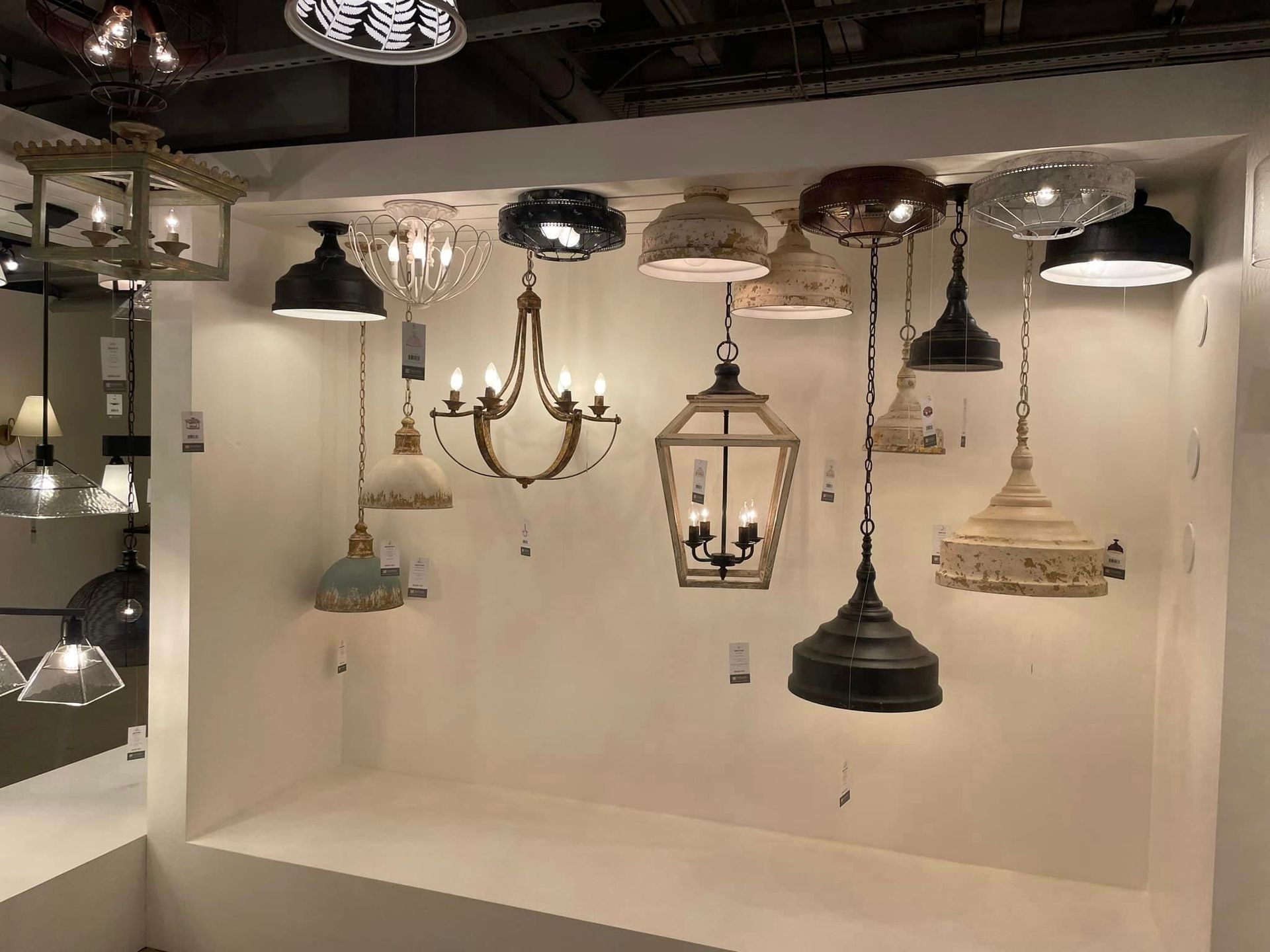 There are many different types of lights hanging from the ceiling.