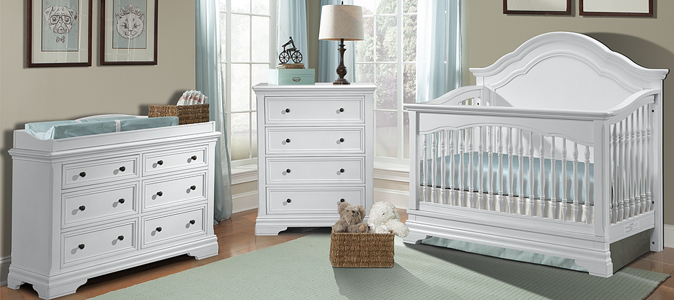 a baby room with a crib, dresser, and changing table.