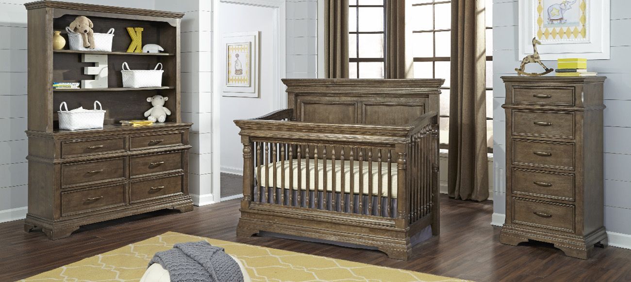 a baby room with a crib, dresser, and hutch.