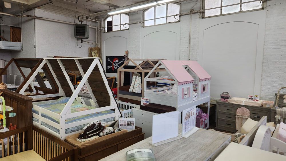 A room filled with lots of furniture and doll houses.