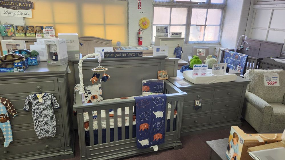 A crib in the middle of the room in a store
