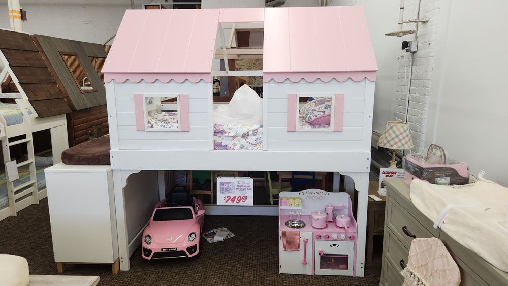 A pink and white doll house