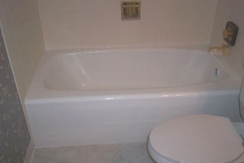 a bathroom with a bathtub and a toilet