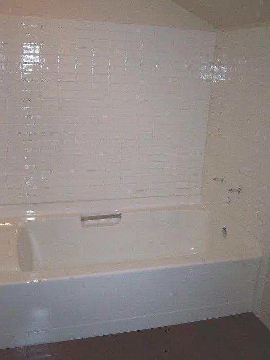 a bathroom with a bathtub and a sink in it