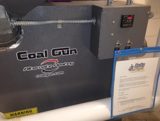 Black Coal Gun machine with warning label and control panel on the right