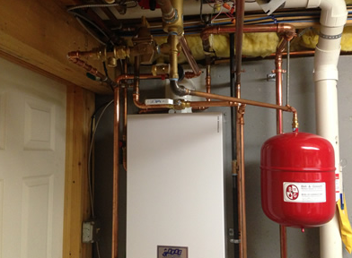 Boiler room with white water heater, copper pipes, and a red expansion tank ceiling-mounted near the wall