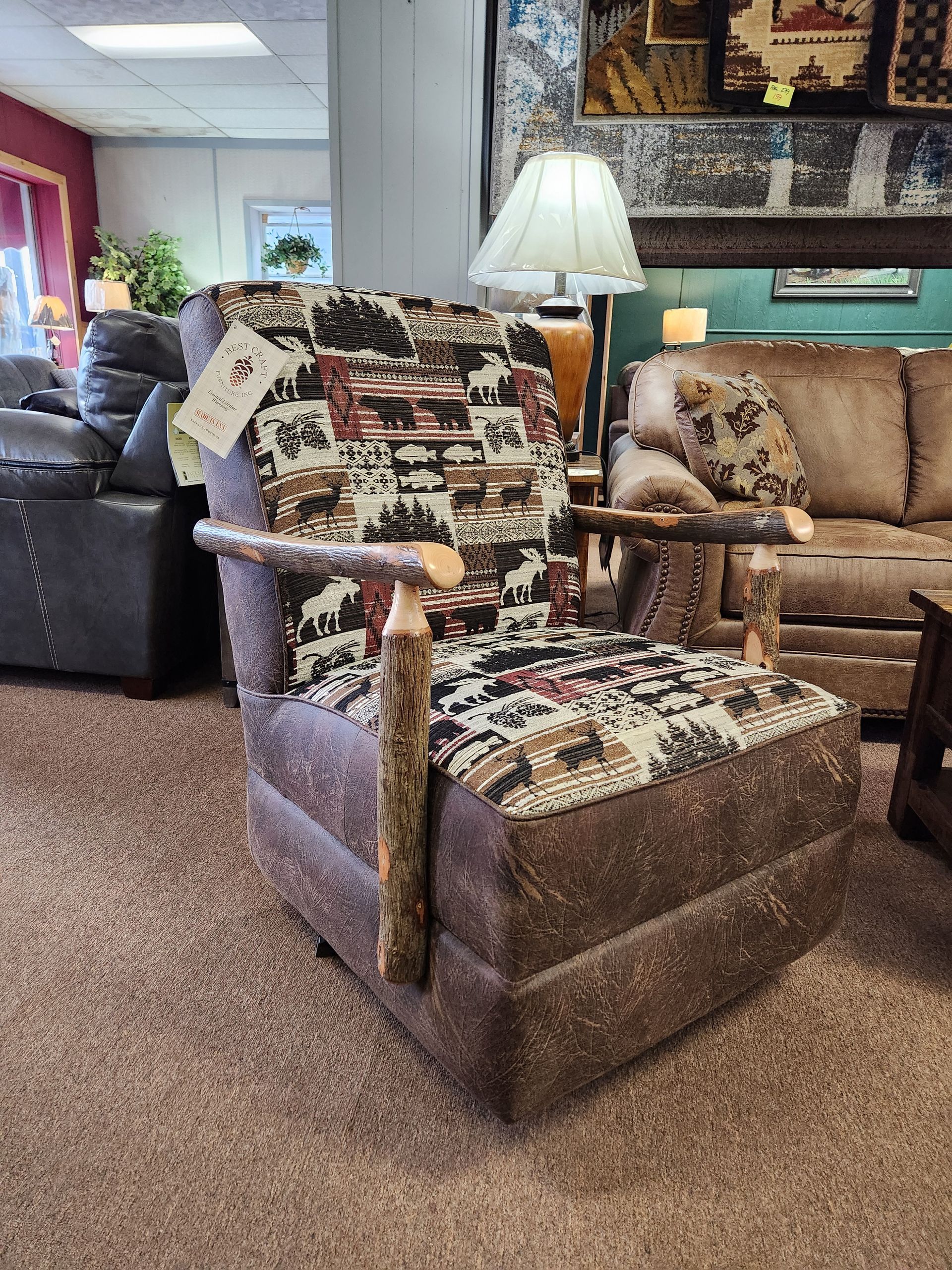 A recliner is sitting in a living room next to a couch and a lamp.