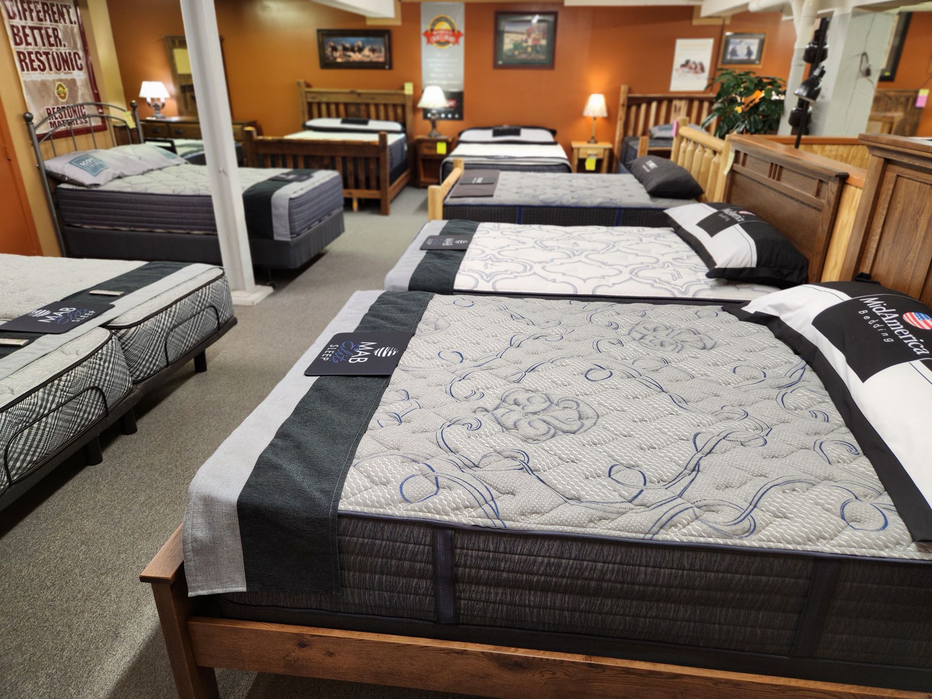 A mattress store with lots of beds and mattresses
