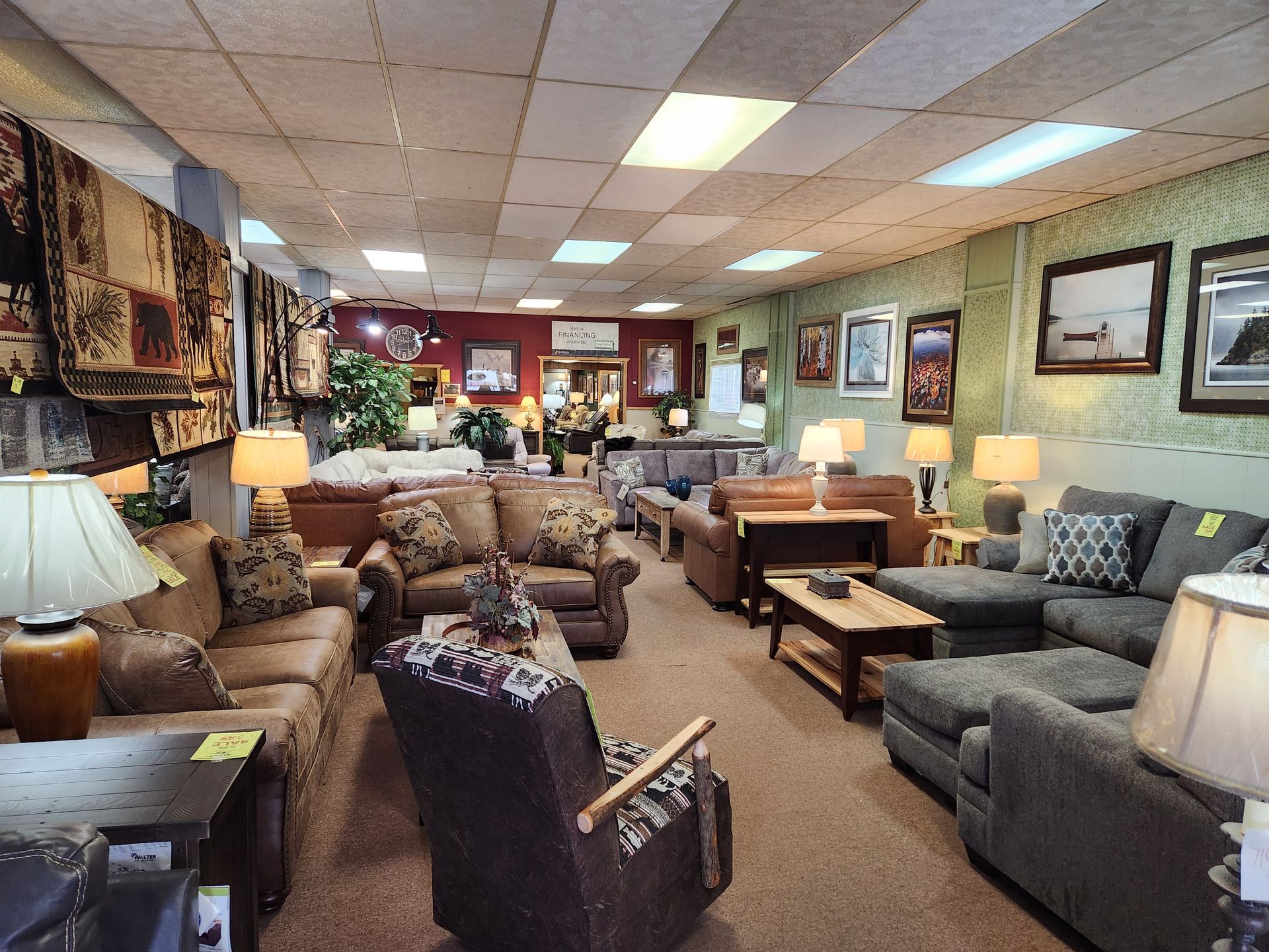 A living room filled with furniture and lamps in a furniture store.