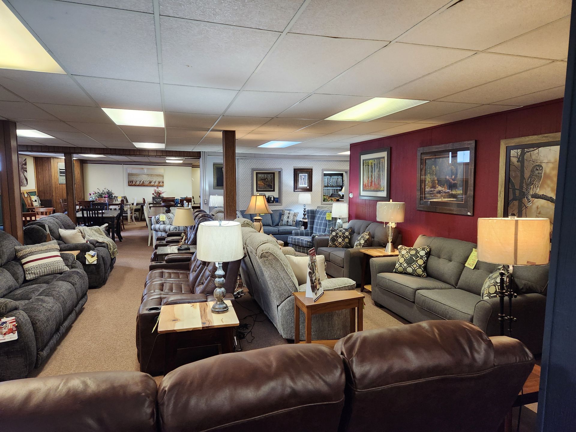 A living room filled with lots of couches and lamps