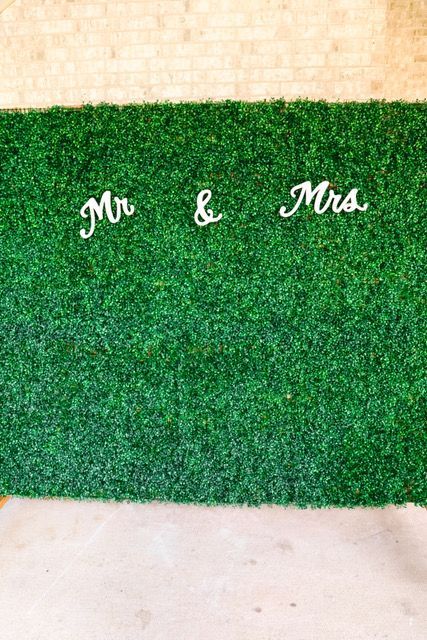 A green wall with the words `` mr. and mrs. '' written on it.