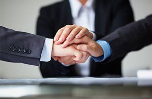 Clients in suits shaking hands