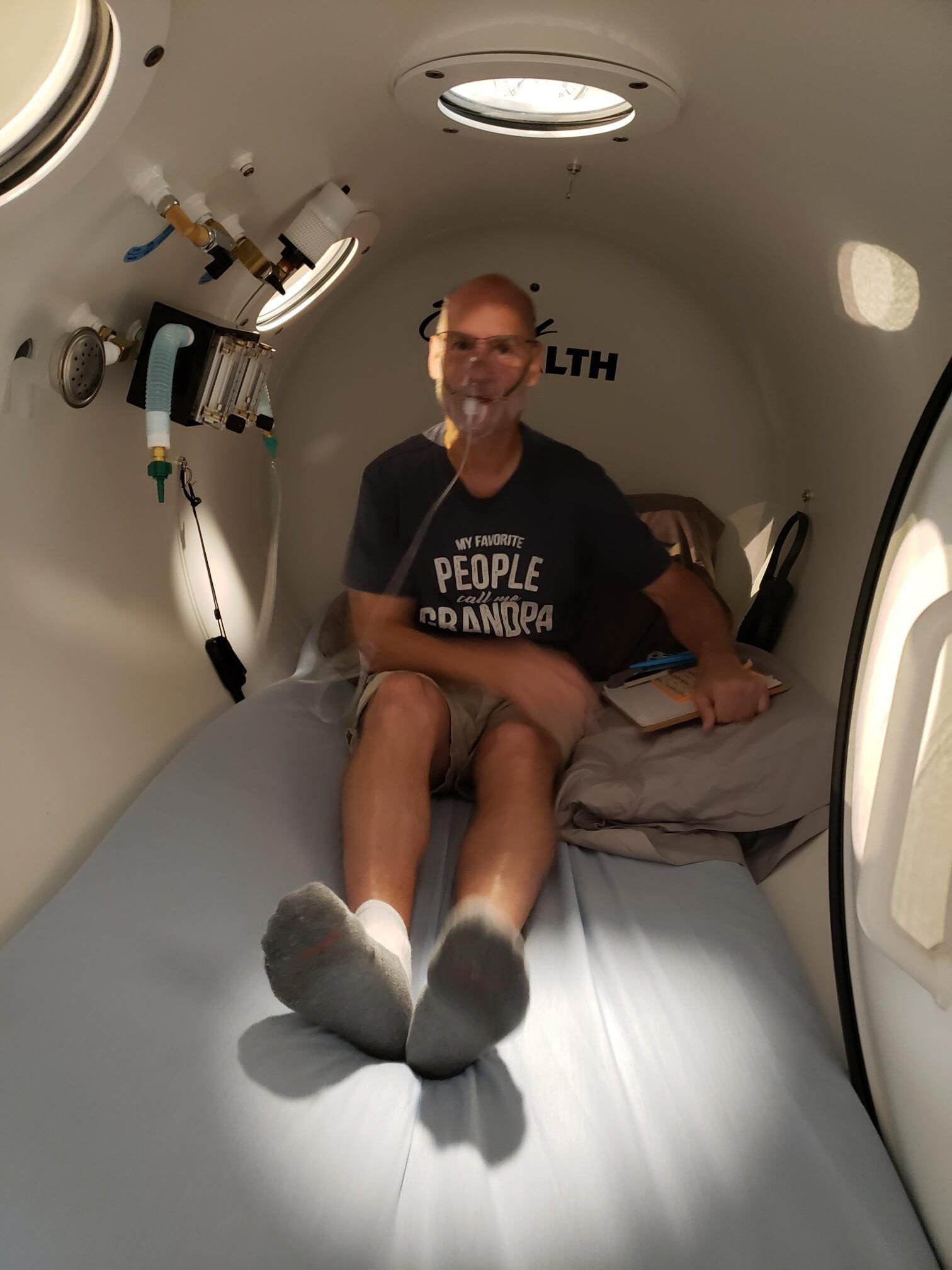 A man wearing a shirt that says people on it