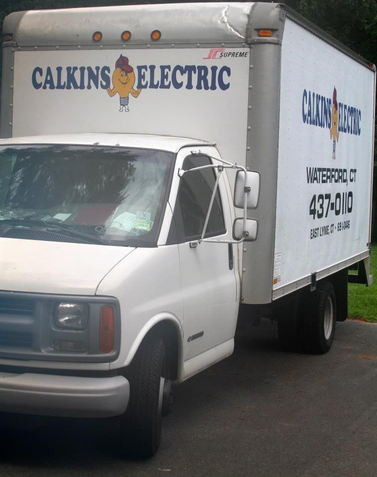 A calkins electric truck is parked on the side of the road