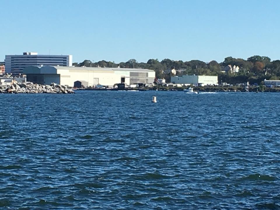 A large body of water with a building in the background