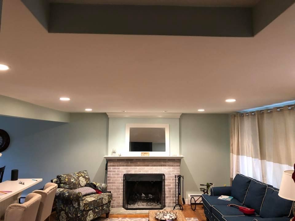 There is a fireplace in the middle of the living room.