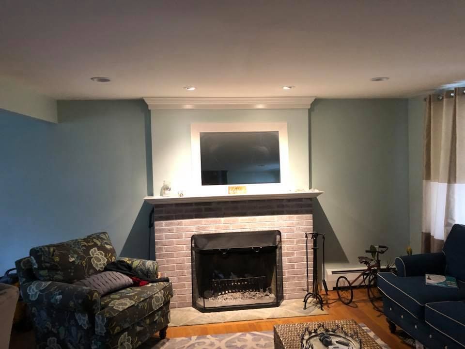 There is a fireplace in the middle of the living room.