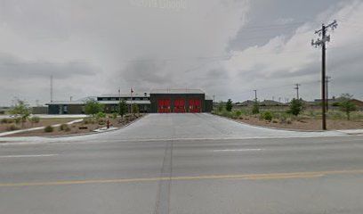 A fire station is located on the side of the road.