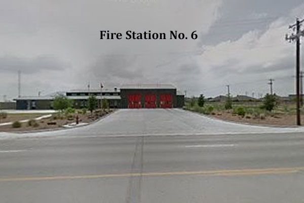A fire station is located on the side of the road.