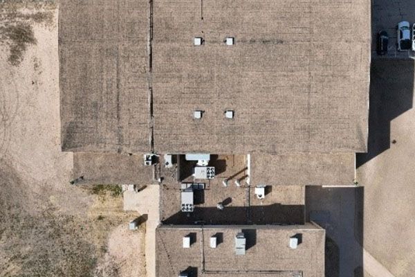 An aerial view of a large building with a lot of windows.