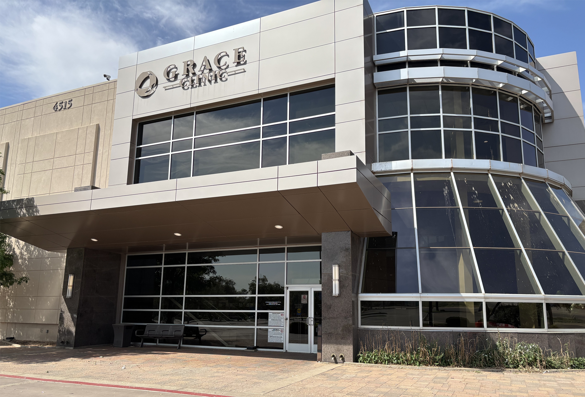 A large building with a lot of windows and the word Grace Clinic on it