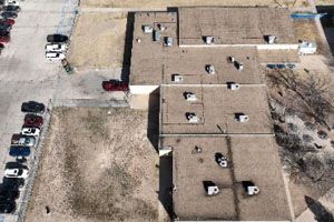 An aerial view of a building with a lot of windows
