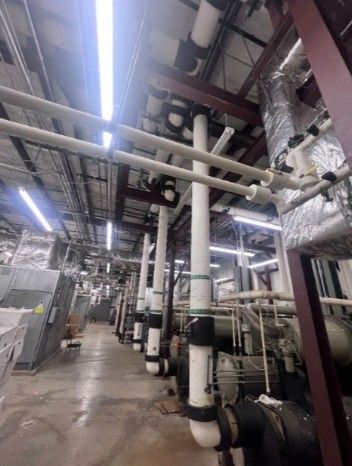 A large room filled with pipes and tubes in a building