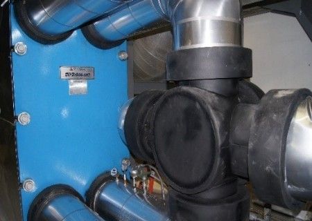 A close up of a blue and black pipe in a room.