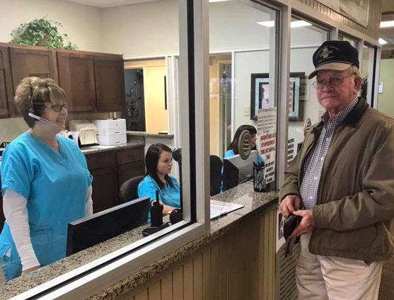 Eye center staff and patient