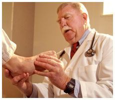 Podiatrist checking patient’s feet