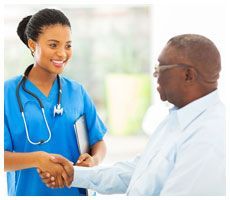 A nurse shaking hand to the patient