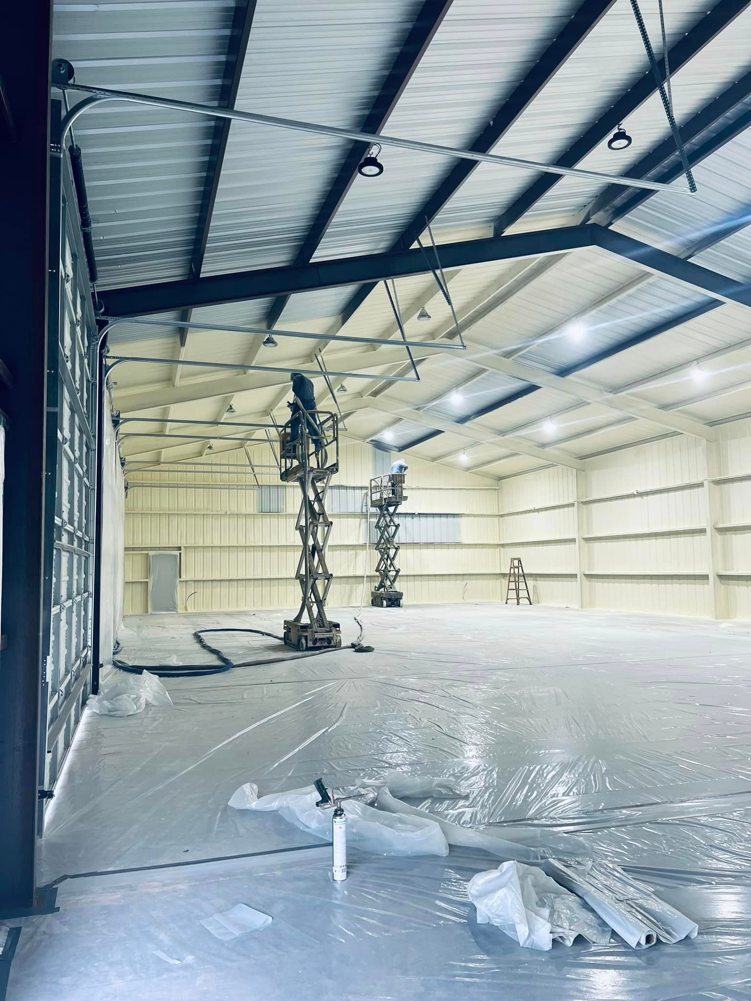 a large warehouse with a lot of machinery in it .