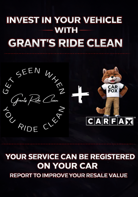 Advertisement for Grant's Ride Clean car service with a CARFAX fox mascot and a mechanic working on a car.