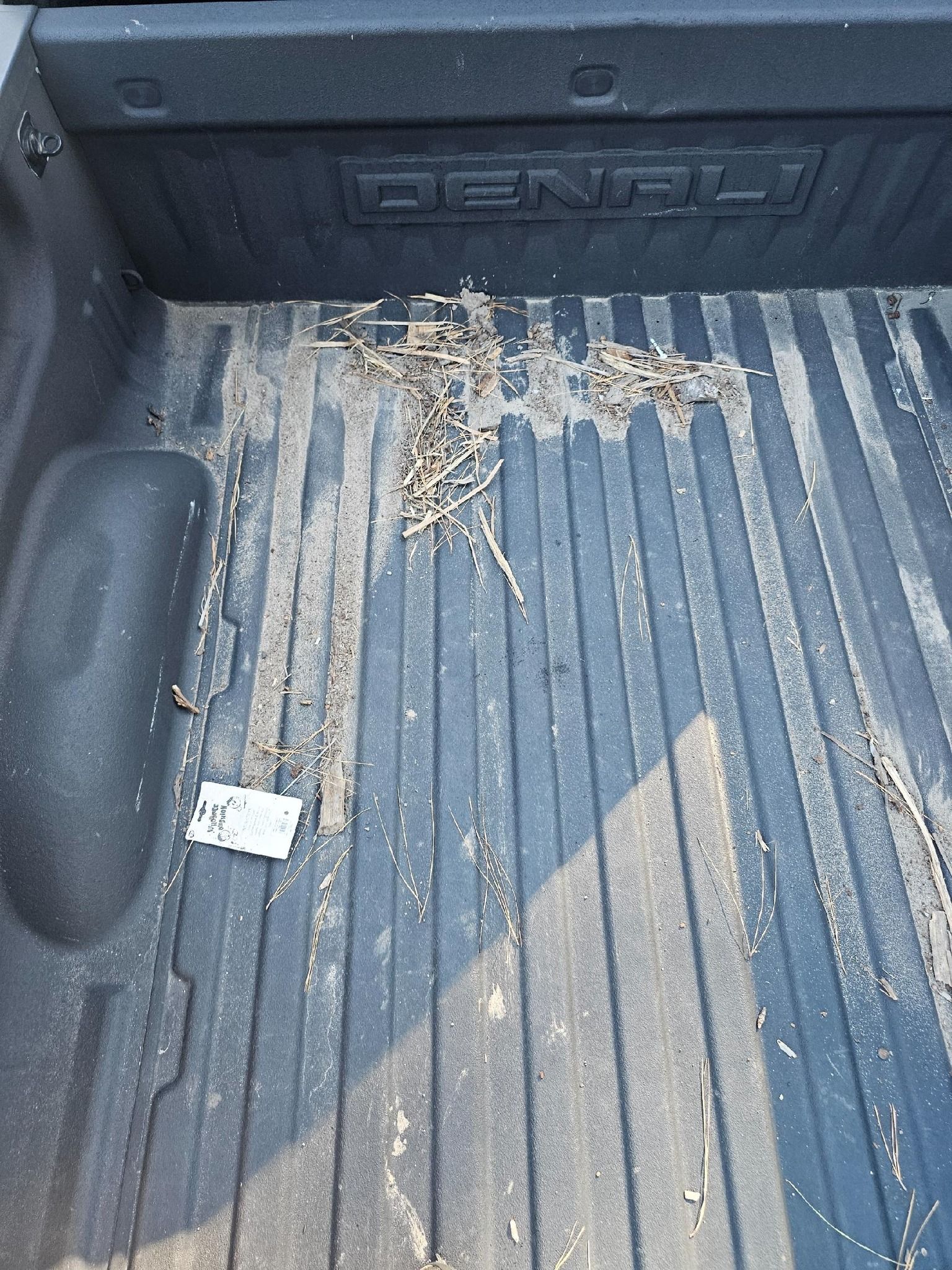 Truck bed with dirt and debris, 