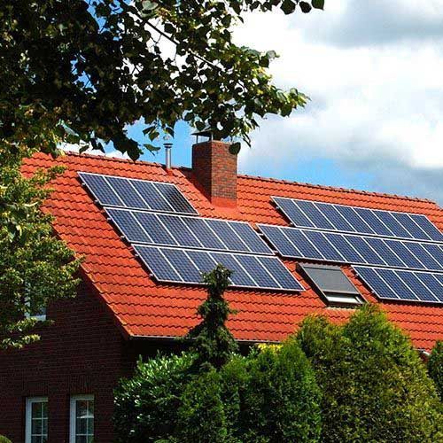 A brick house with solar panels on the roof