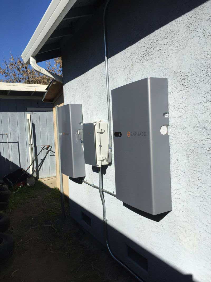 A house with a lot of electrical boxes on the side of it