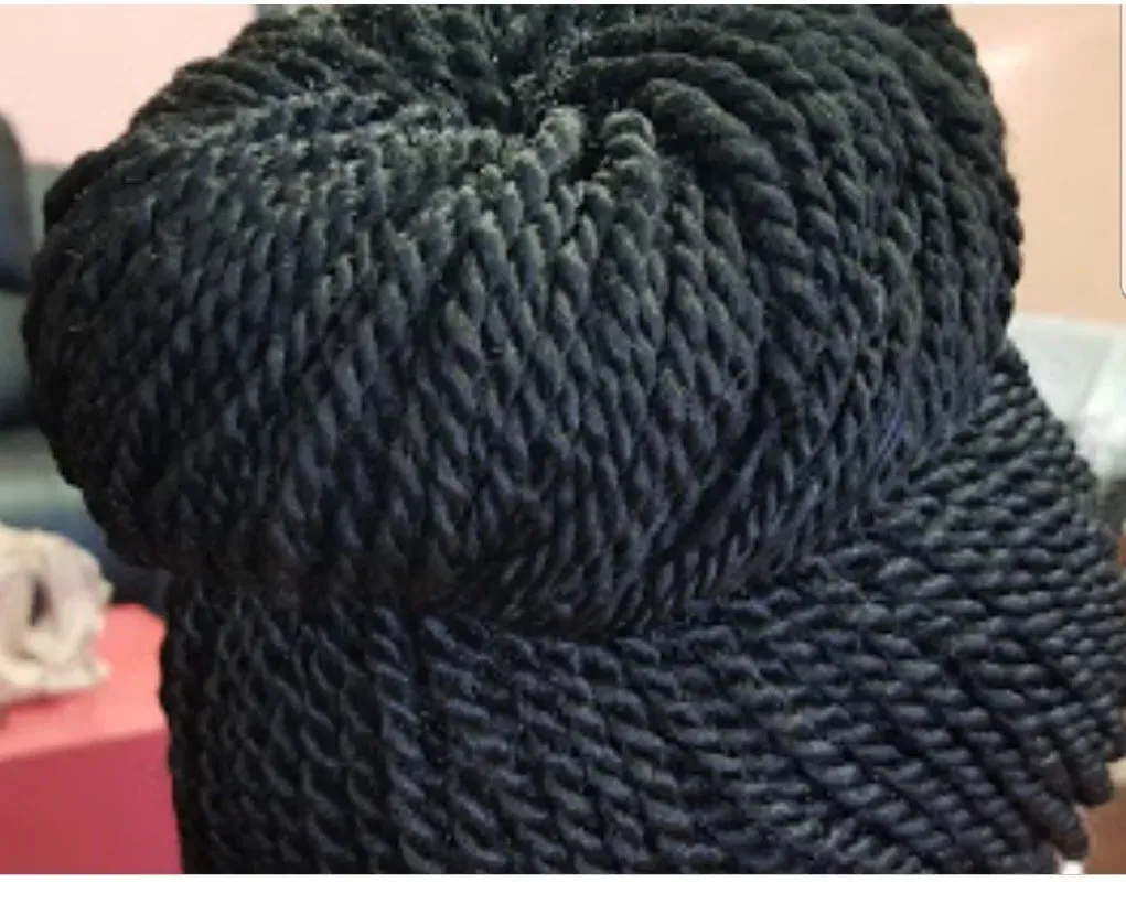 Black braided cap, close-up view.