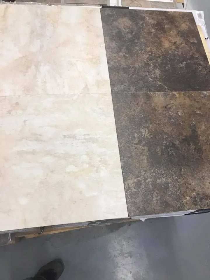 Two ceramic tiles, beige and brown, displayed side-by-side with texture.