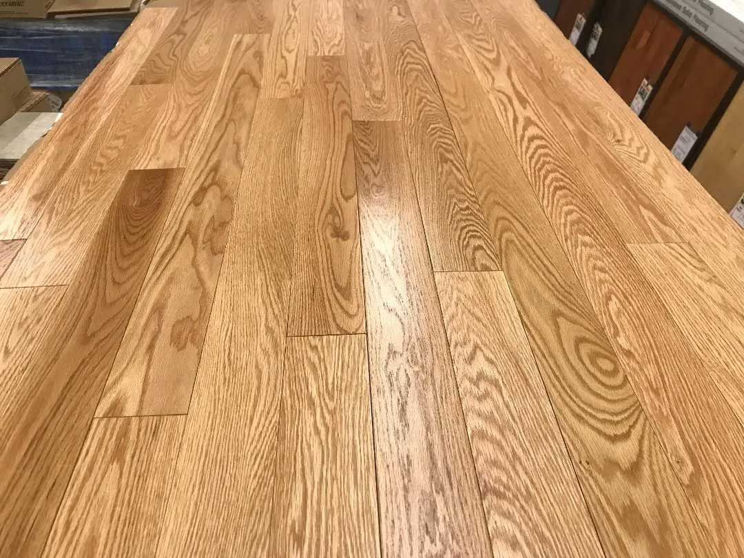 Wooden floorboards, light brown with visible wood grain.