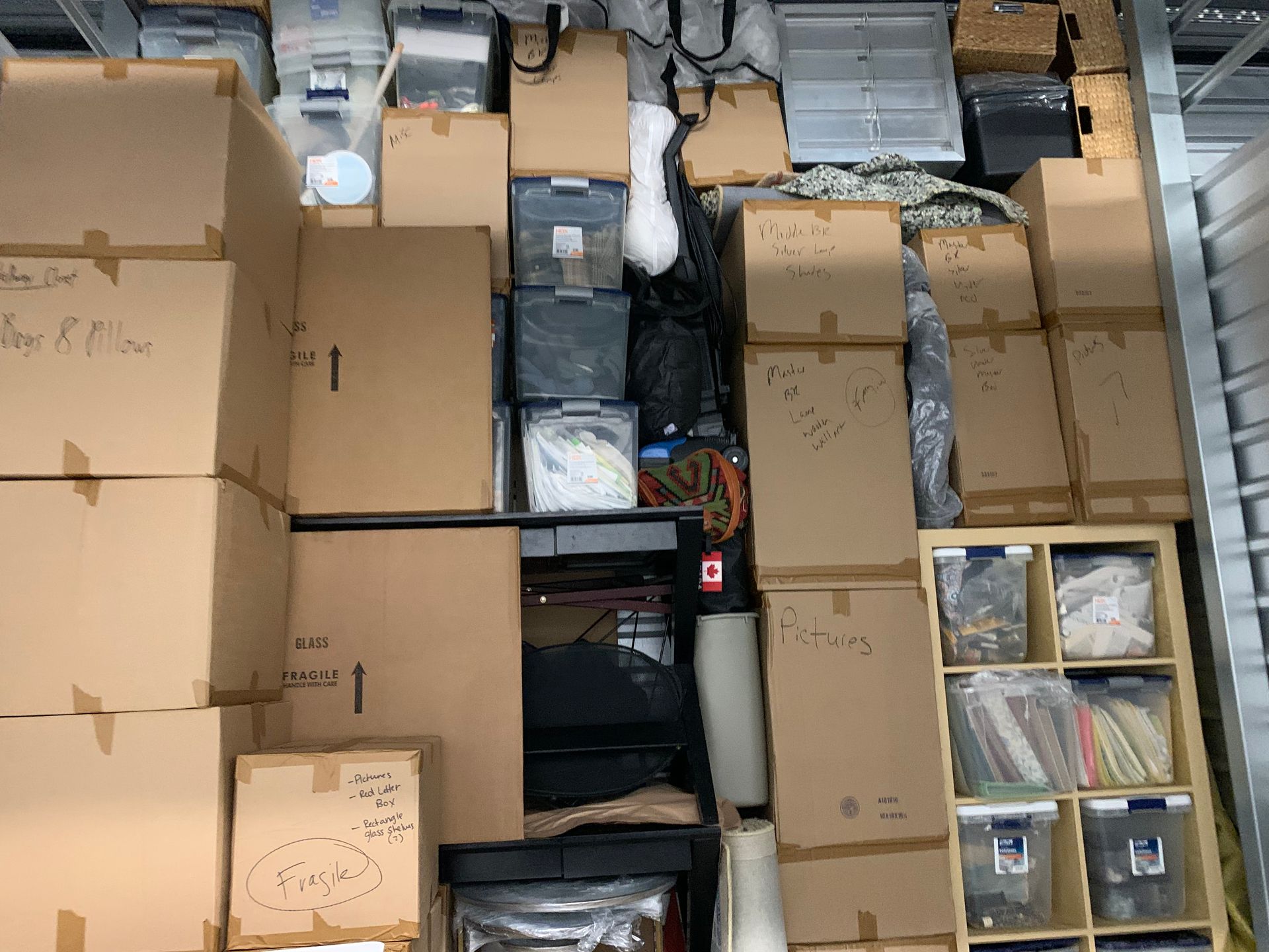 A bunch of cardboard boxes are stacked on top of each other