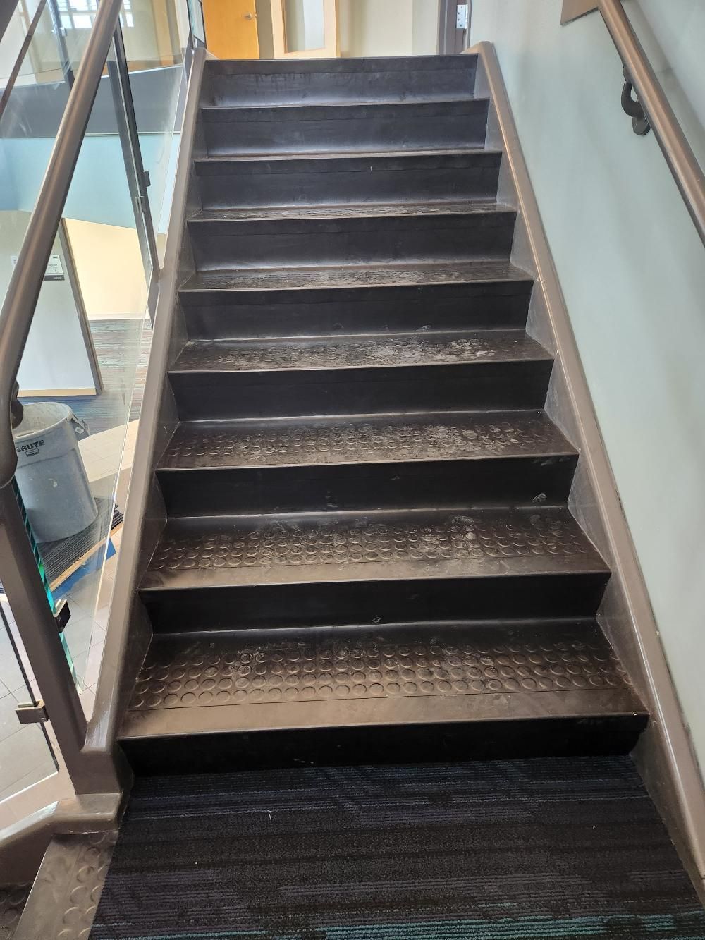 A set of stairs leading up to the second floor of a building.