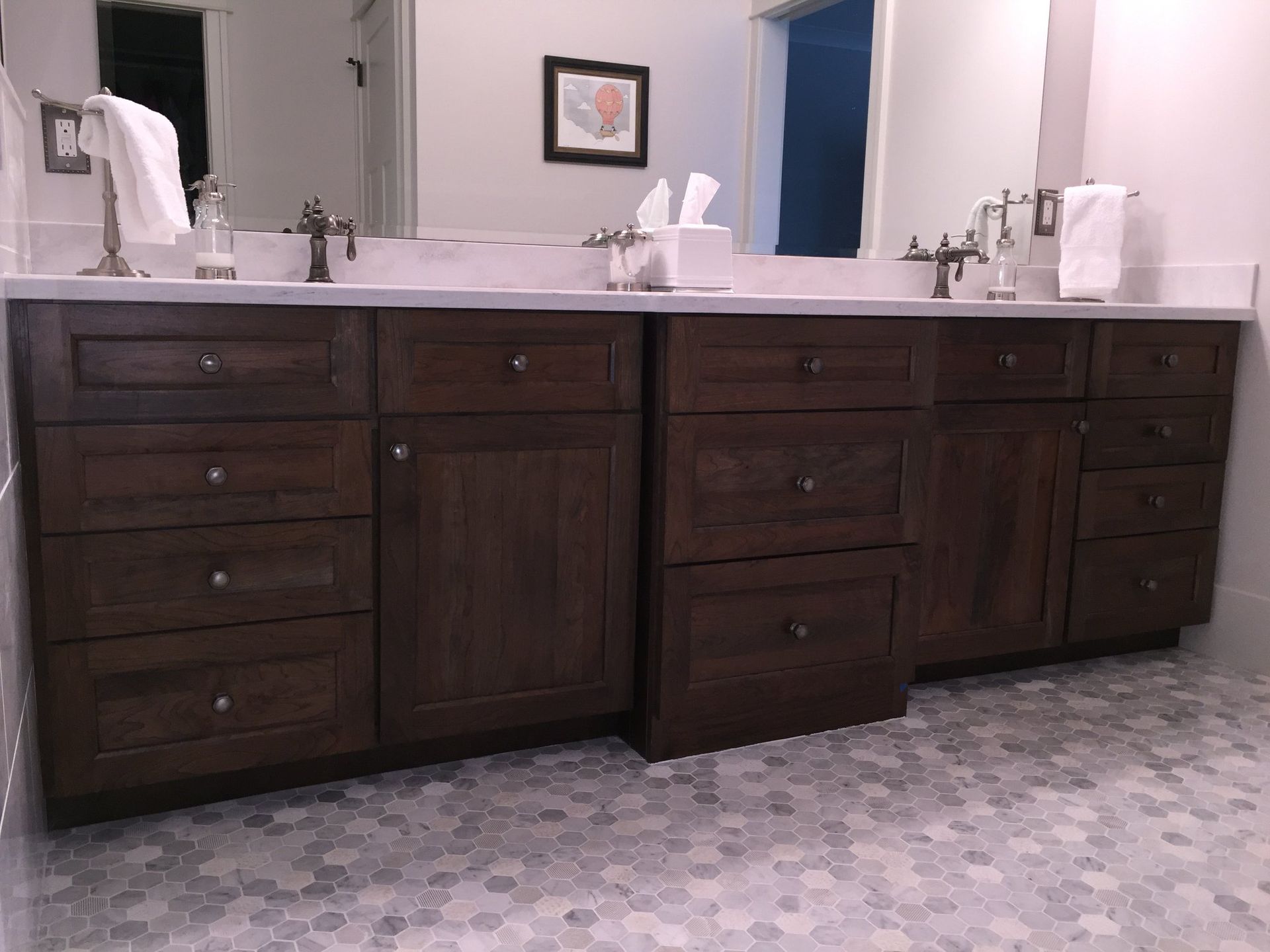 A bathroom with two sinks and a mirror