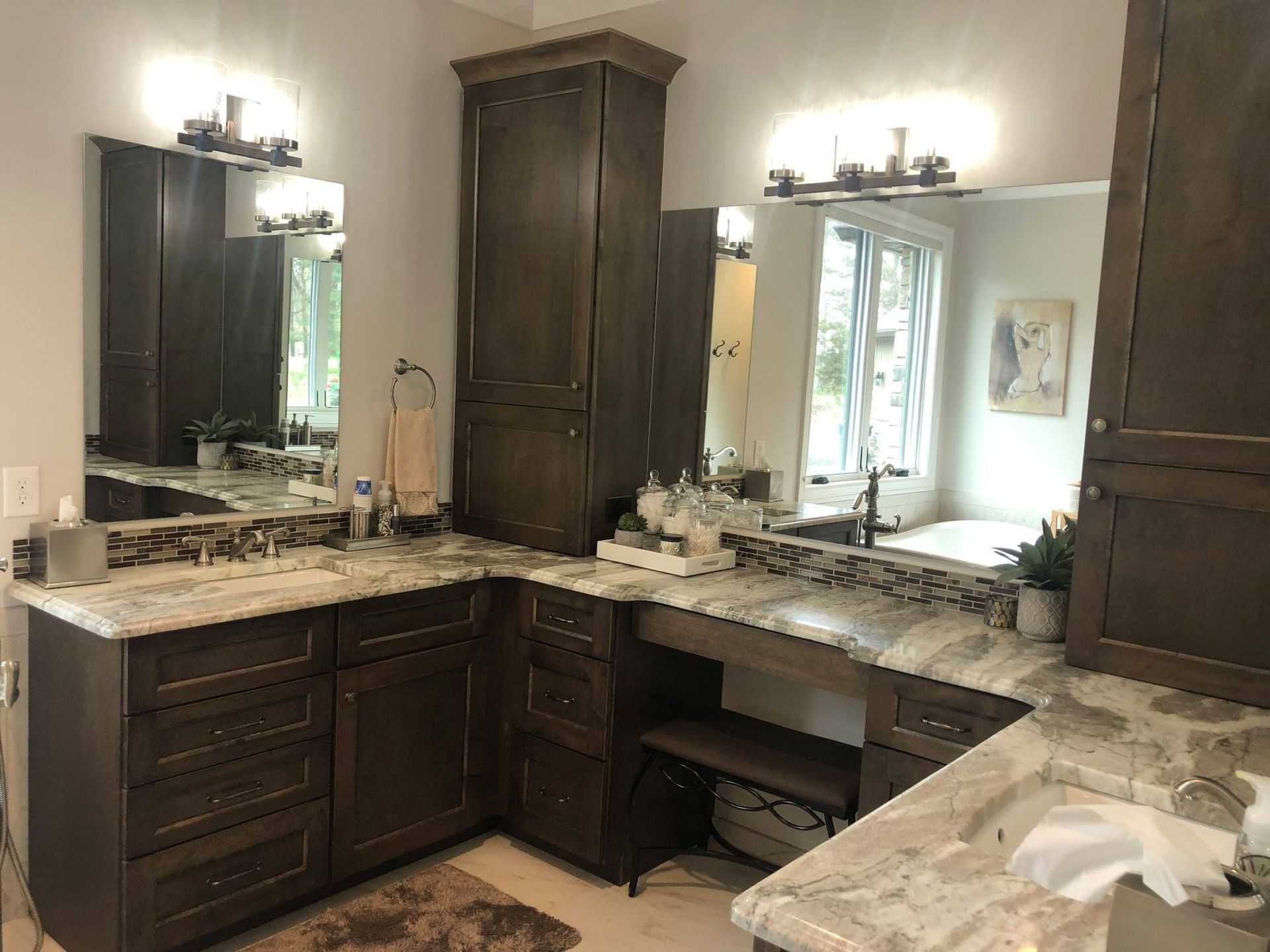 A bathroom with two sinks and two mirrors.
