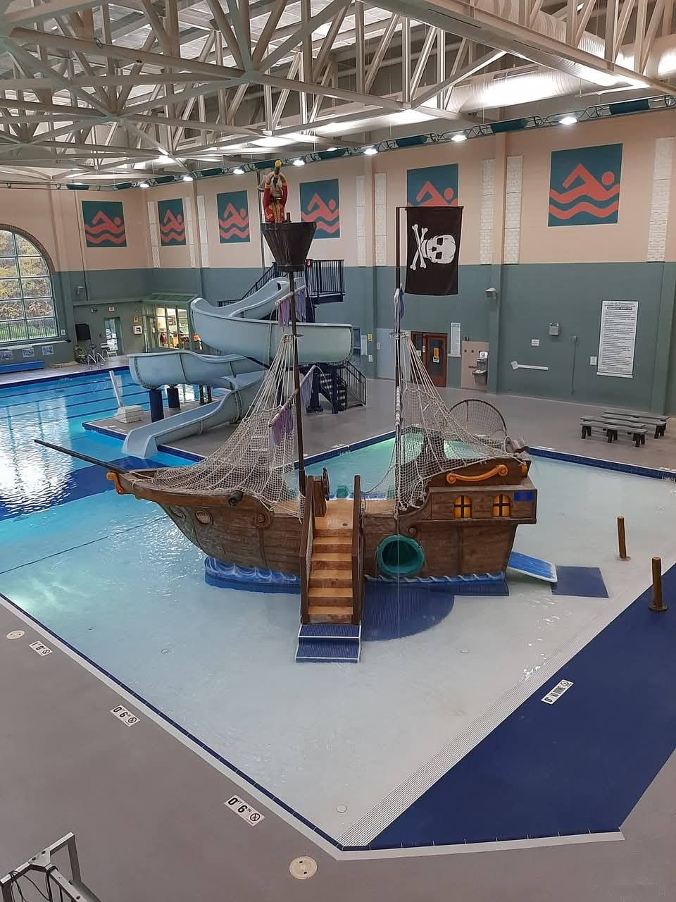 Pirate ship play structure in a swimming pool.