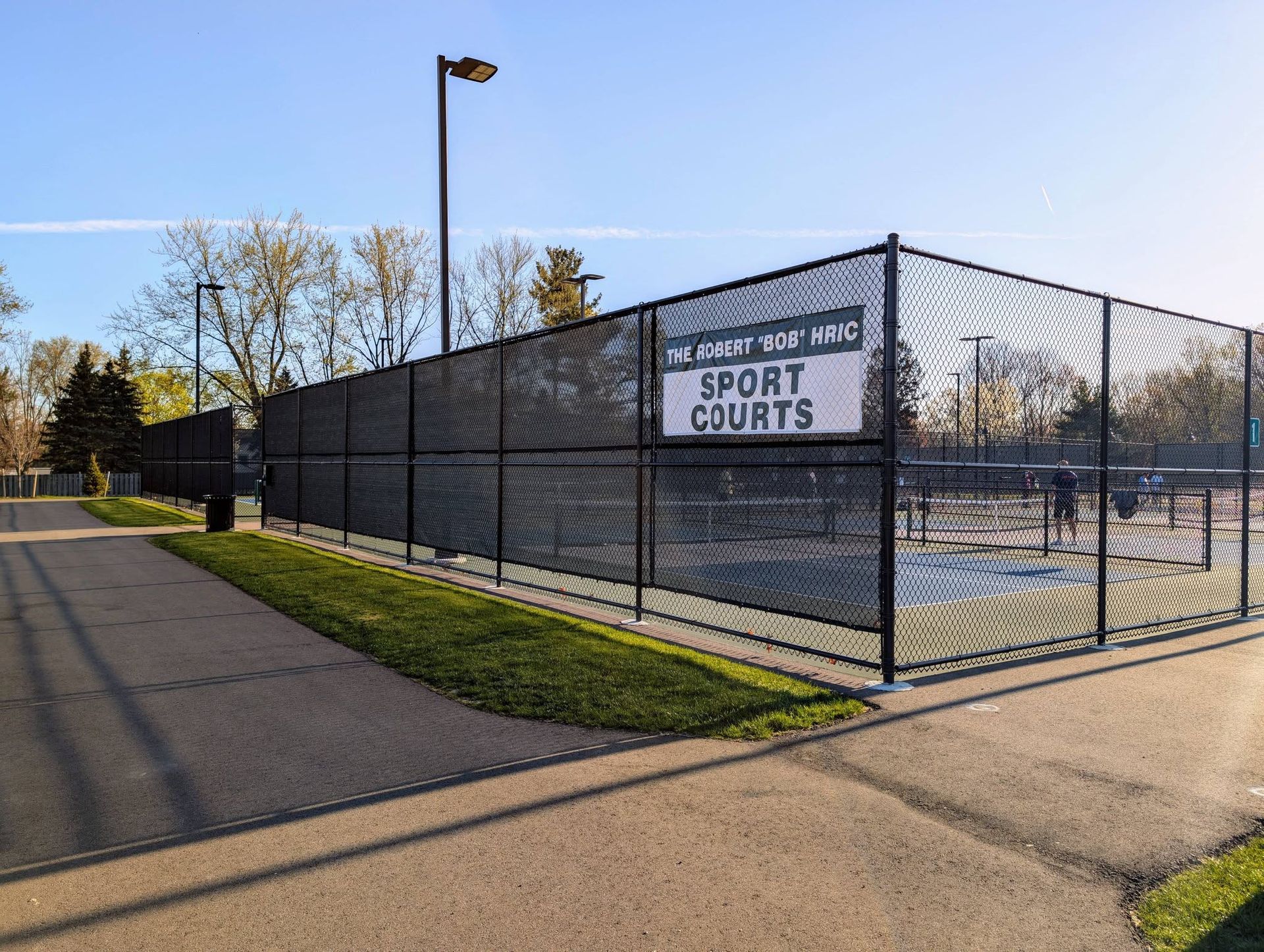 Black chain-link fence surrounds